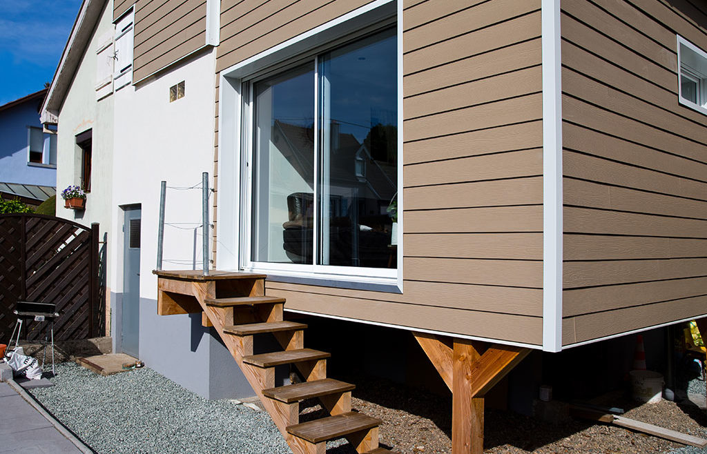 Agrandissement de maison : ossature bois et bardage fibro-ciment